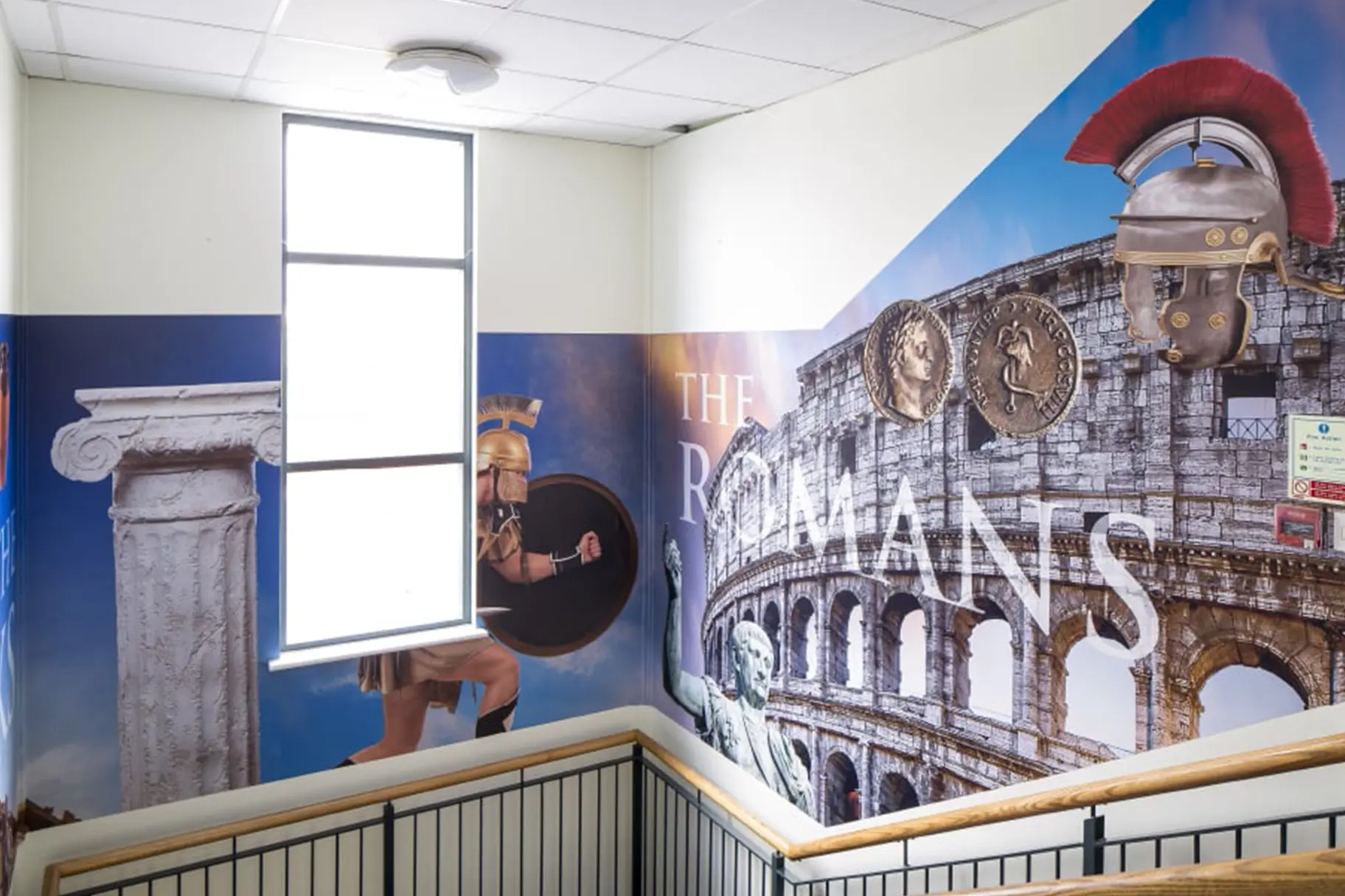 The Romans themed school stairwell makeover wall art