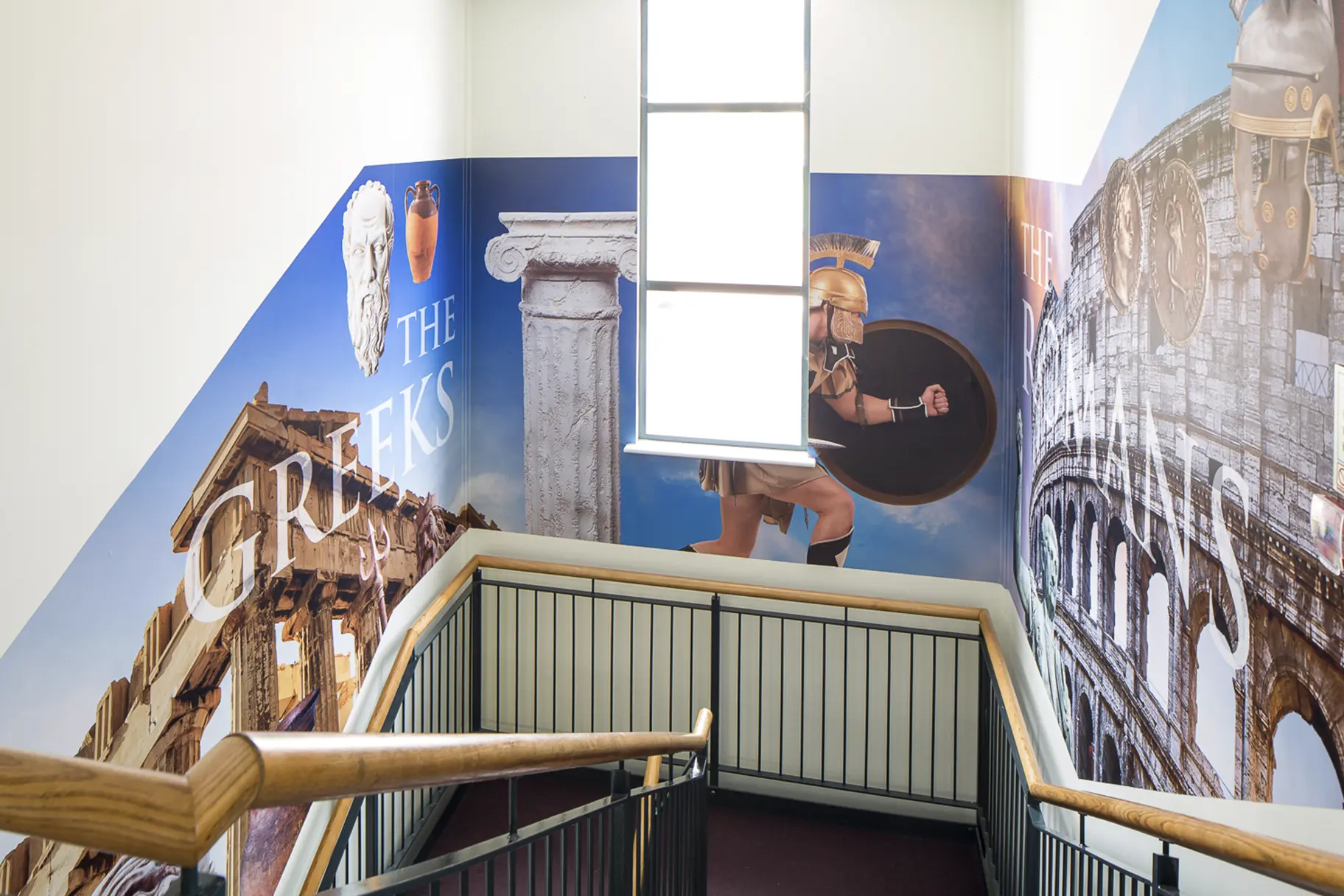 History themed subject zone school stairwell makeover wall art